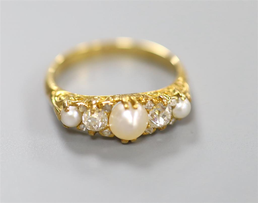 An Edwardian yellow metal, split pearl and diamond set half hoop ring, size N, gross 3.6 grams.